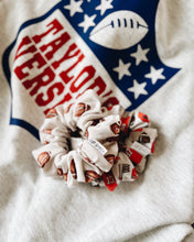 Load image into Gallery viewer, “Tossed Footballs on Ivory” Scrunchie
